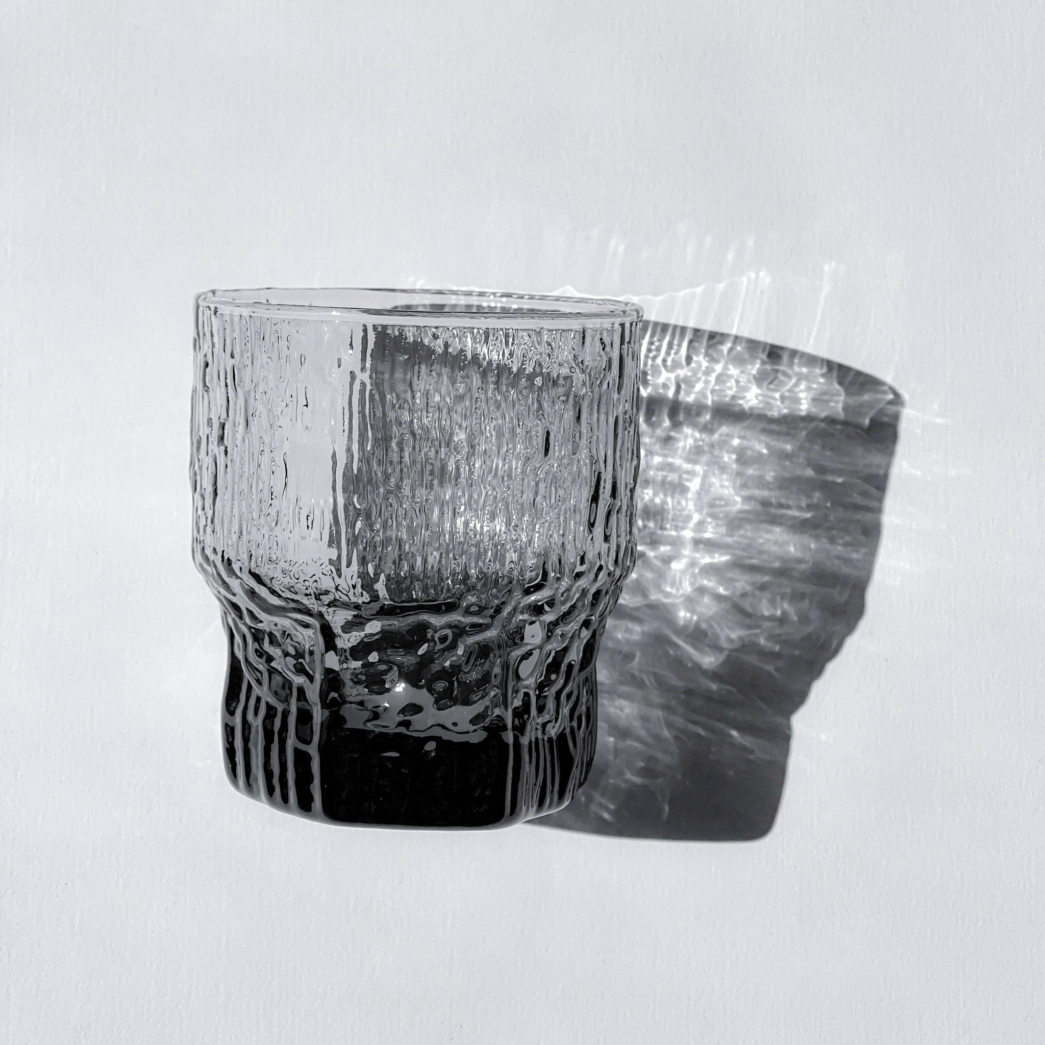 Set of 9 Aslak textured grey glasses by Tapio Wirkkala for Iittala, Finland, 1970s.
