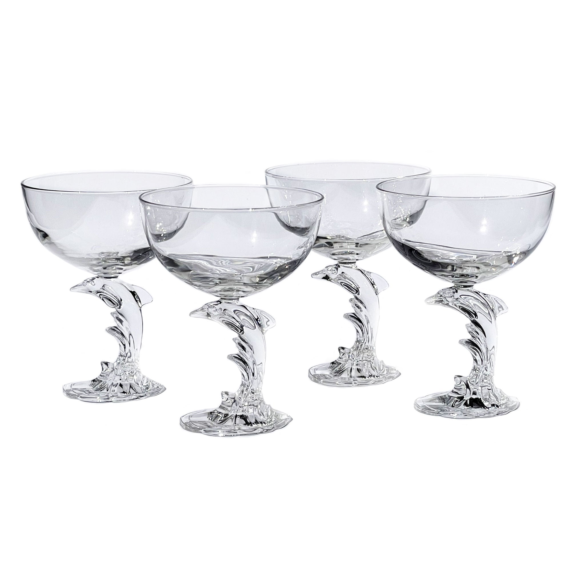 Set of 4 champagne glasses with sculptural dolphin-shaped stem, France, 1980s.