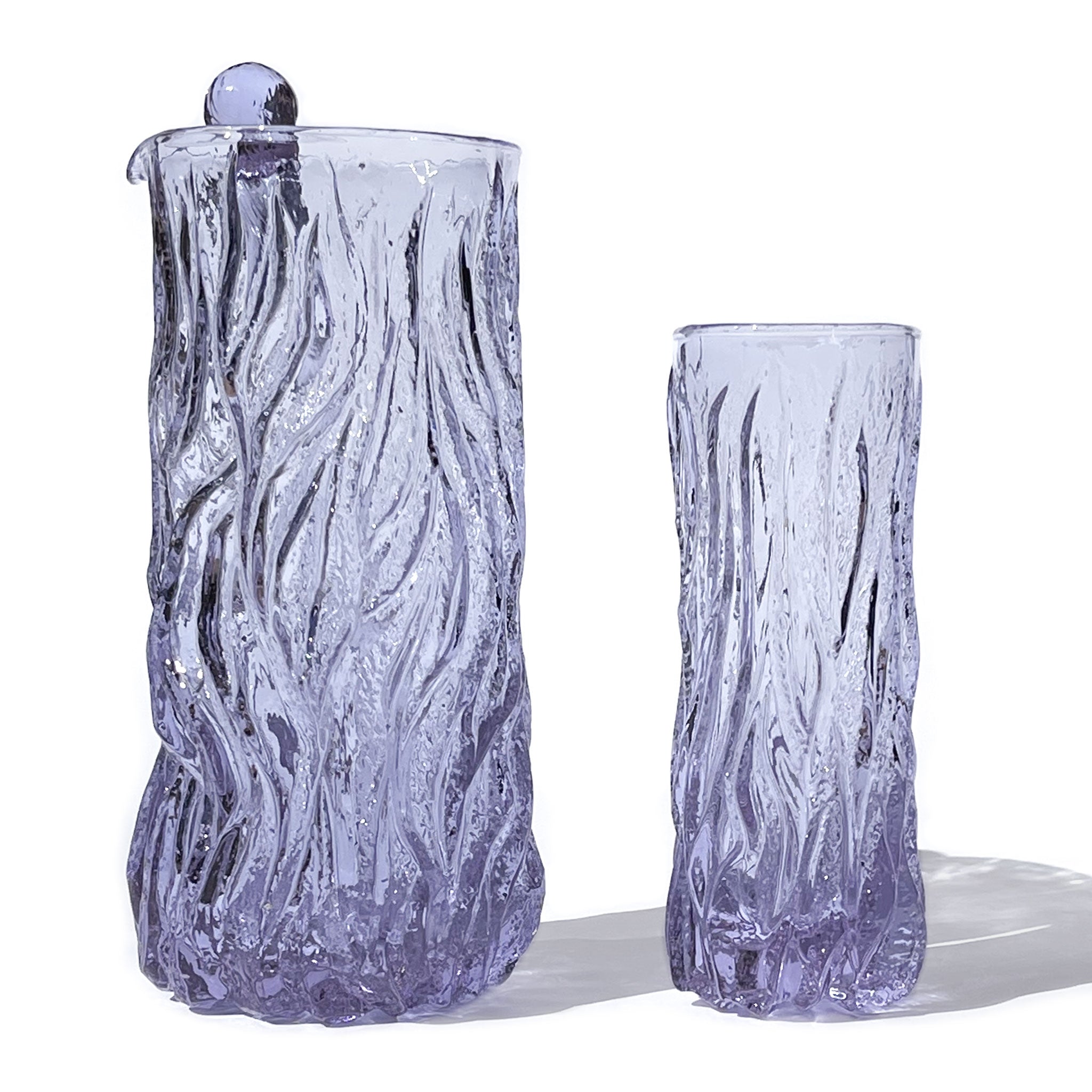 Brutalist set of 6 glasses with pitcher and stirrer in textured neodymium glass, Italy, 1970s.