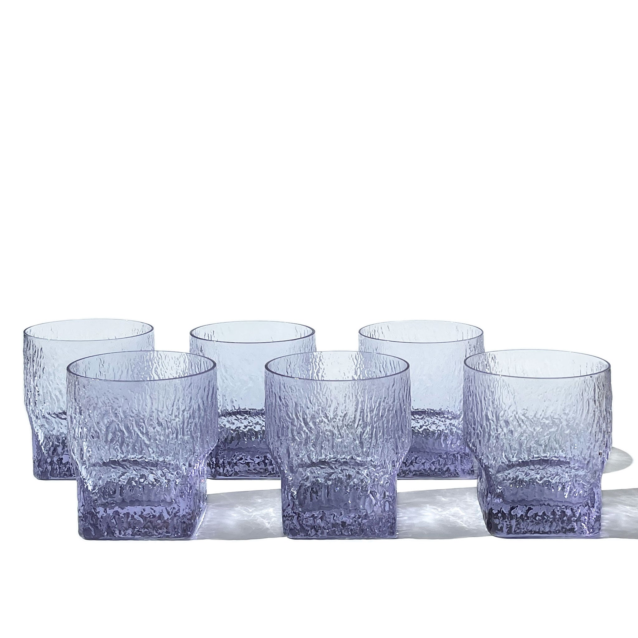 Brutalist set of 6 sculptural glasses in textured neodymium glass, Italy, 1970s.