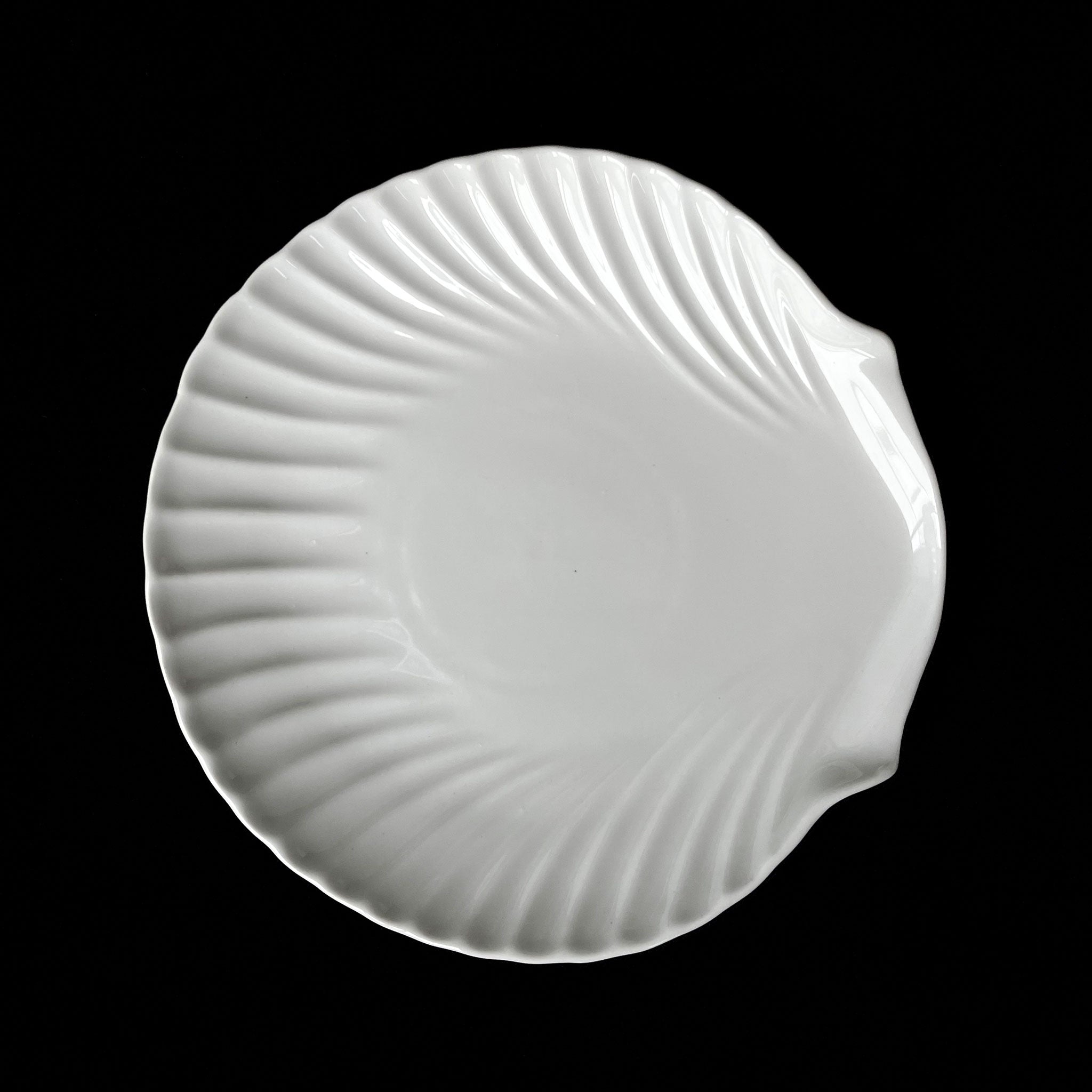 Set of 4 white ceramic shell plates — sculptural tableware.