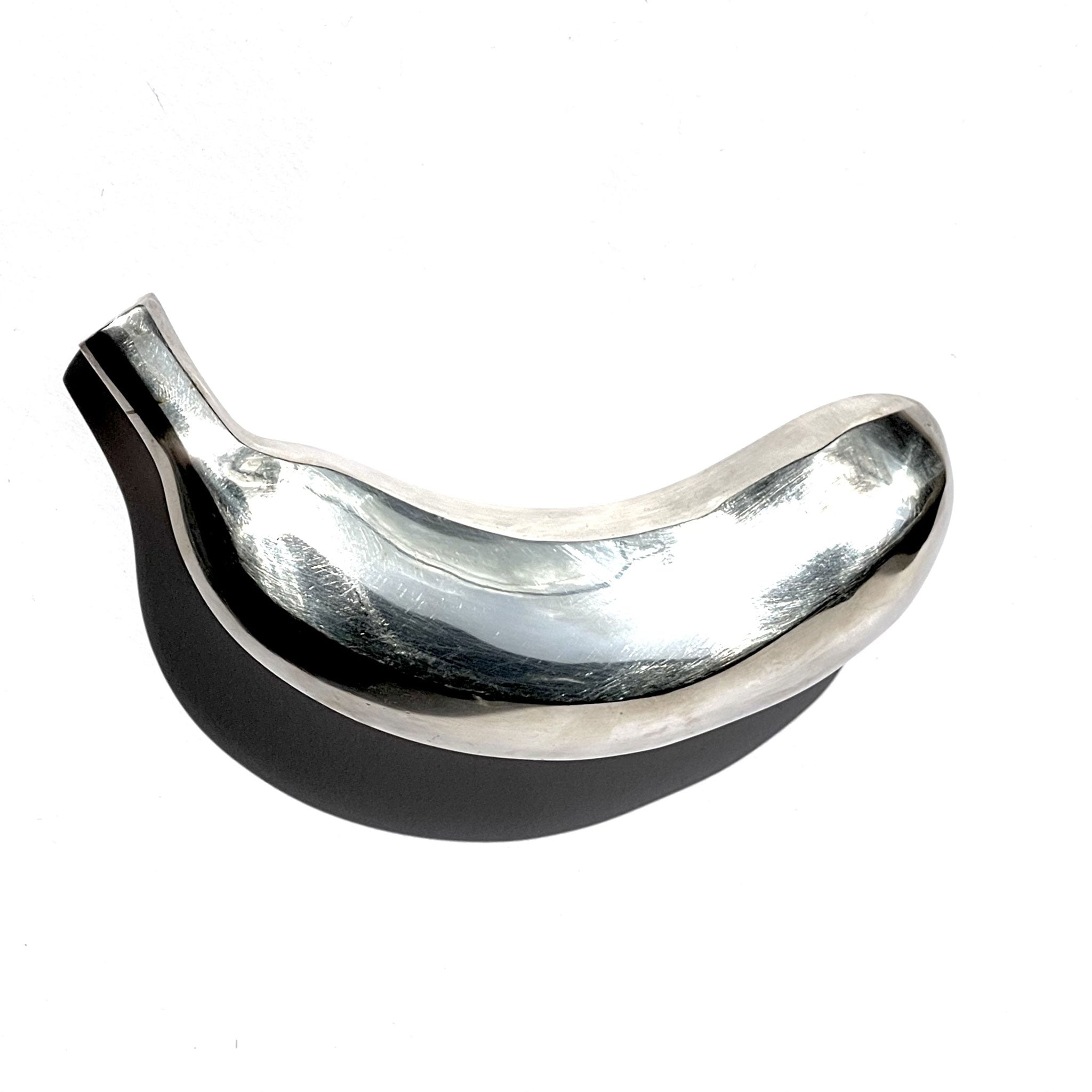 Silver banana — life-size sculpture. Garden Futures.