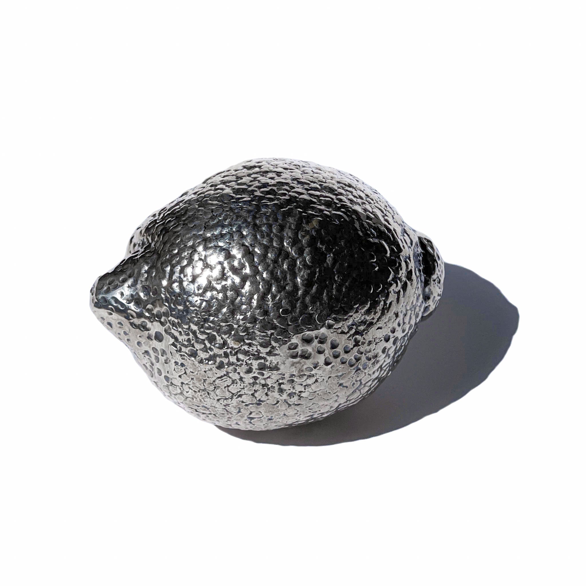 Silver lemon — life-size sculpture. Garden Futures.