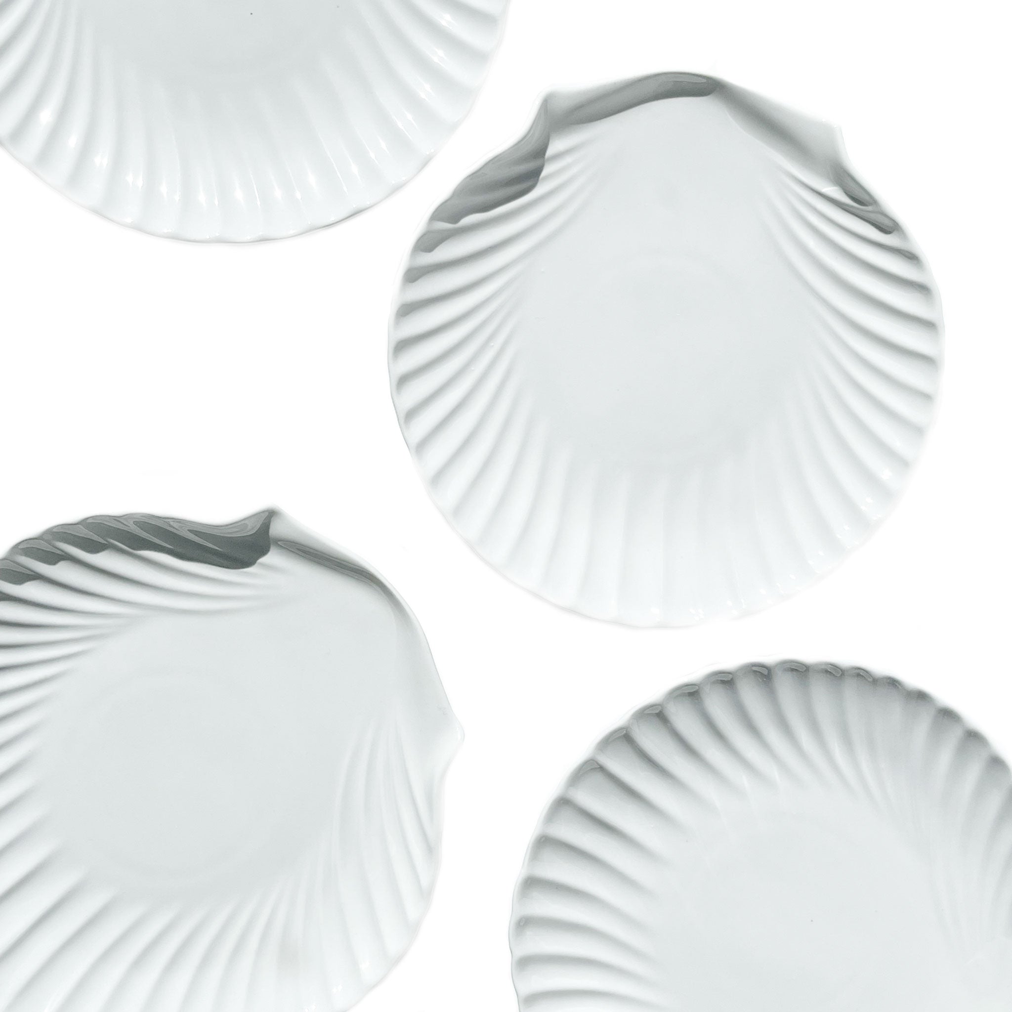 Set of 4 white ceramic shell plates — sculptural tableware.